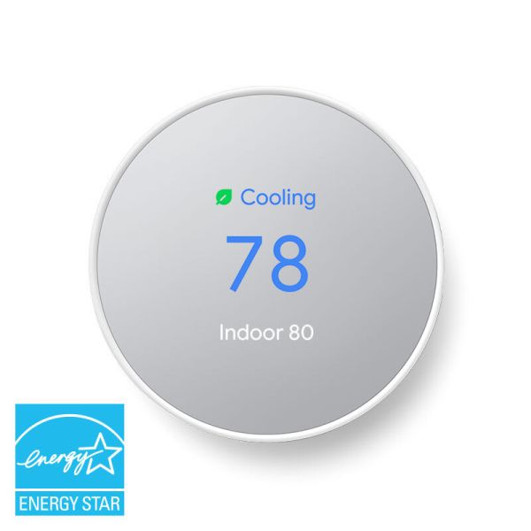 A snow colored Google Nest Thermostat on a white background and a blue EnergyStar logo in the left corner